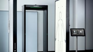 The combined solution of Garrett’s walk-through metal detector and Rohde & Schwarz’ QPS201 security scanner for high security screening applications. The combined solution of Garrett’s walk-through metal detector and Rohde & Schwarz’ QPS201 security scanner for high security screening applications.